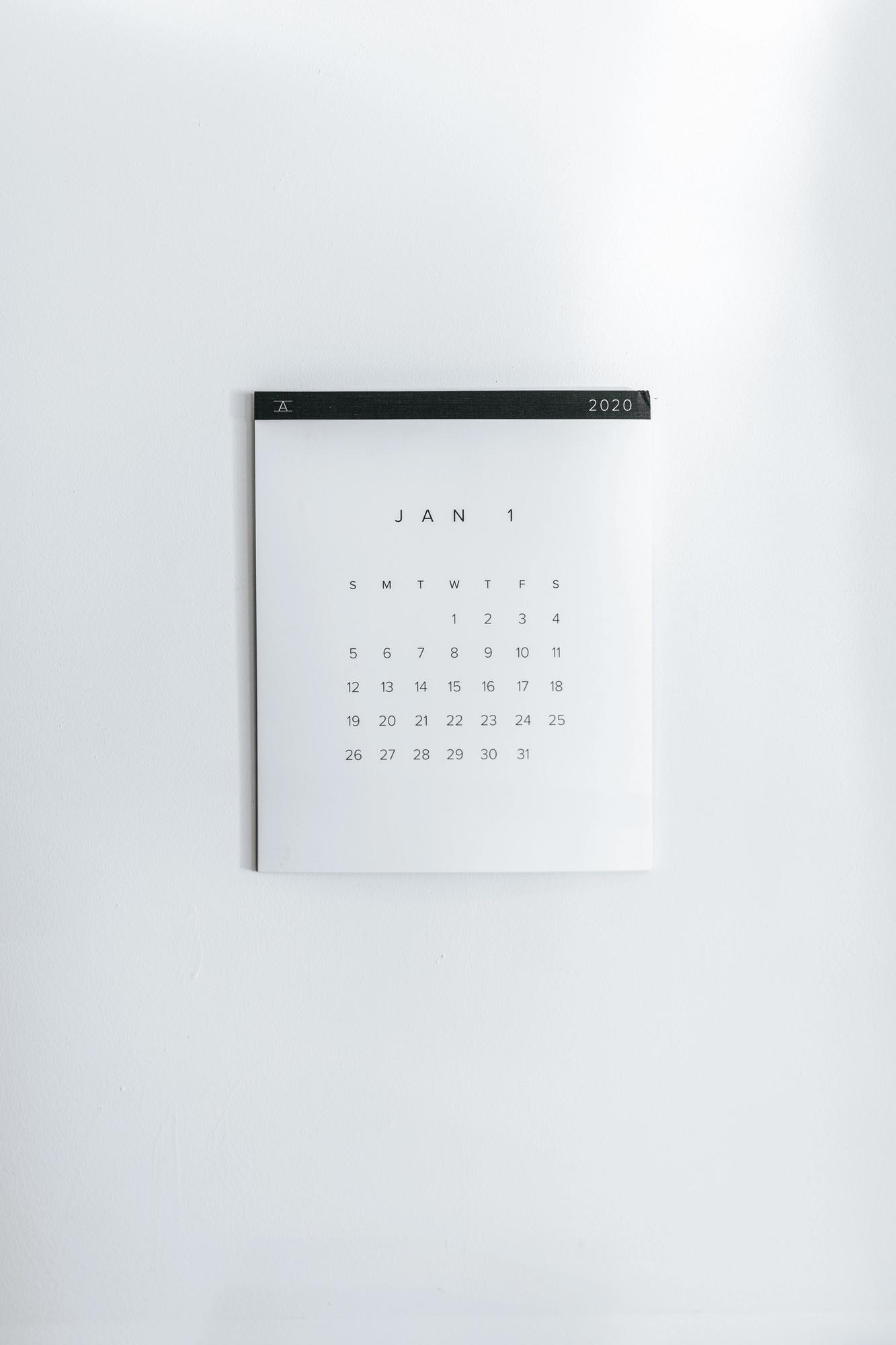 a flat lay copy of a calendar, how to create an editorial calendar templates using notion, notion templates