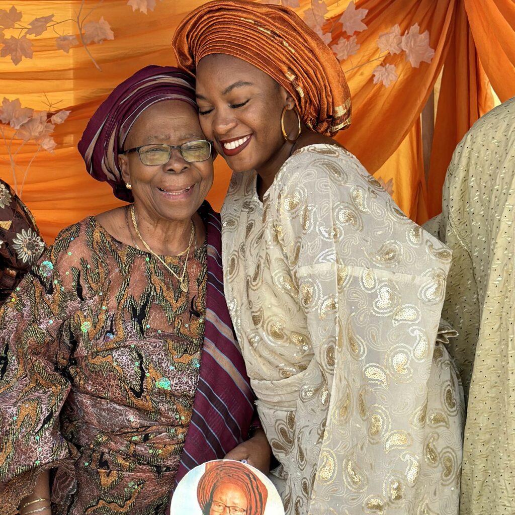 Ademusoyo and her grandmother celebrating her 90th birthday.